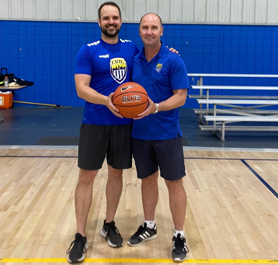 Erie Prep Academy director of post-graduate basketball Dave Briski and Erie Sports Center owner Troy Bingham pose Monday at the center, where Briski was formally introduced.