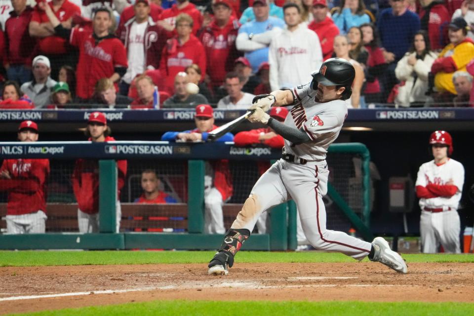 Arizona Diamondbacks left fielder Corbin Carroll (7) hits an RBI sacrifice fly during the seventh inning against the Philadelphia Phillies in game seven of the NLCS at Citizens Bank Park in Philadelphia on Oct. 24, 2023.