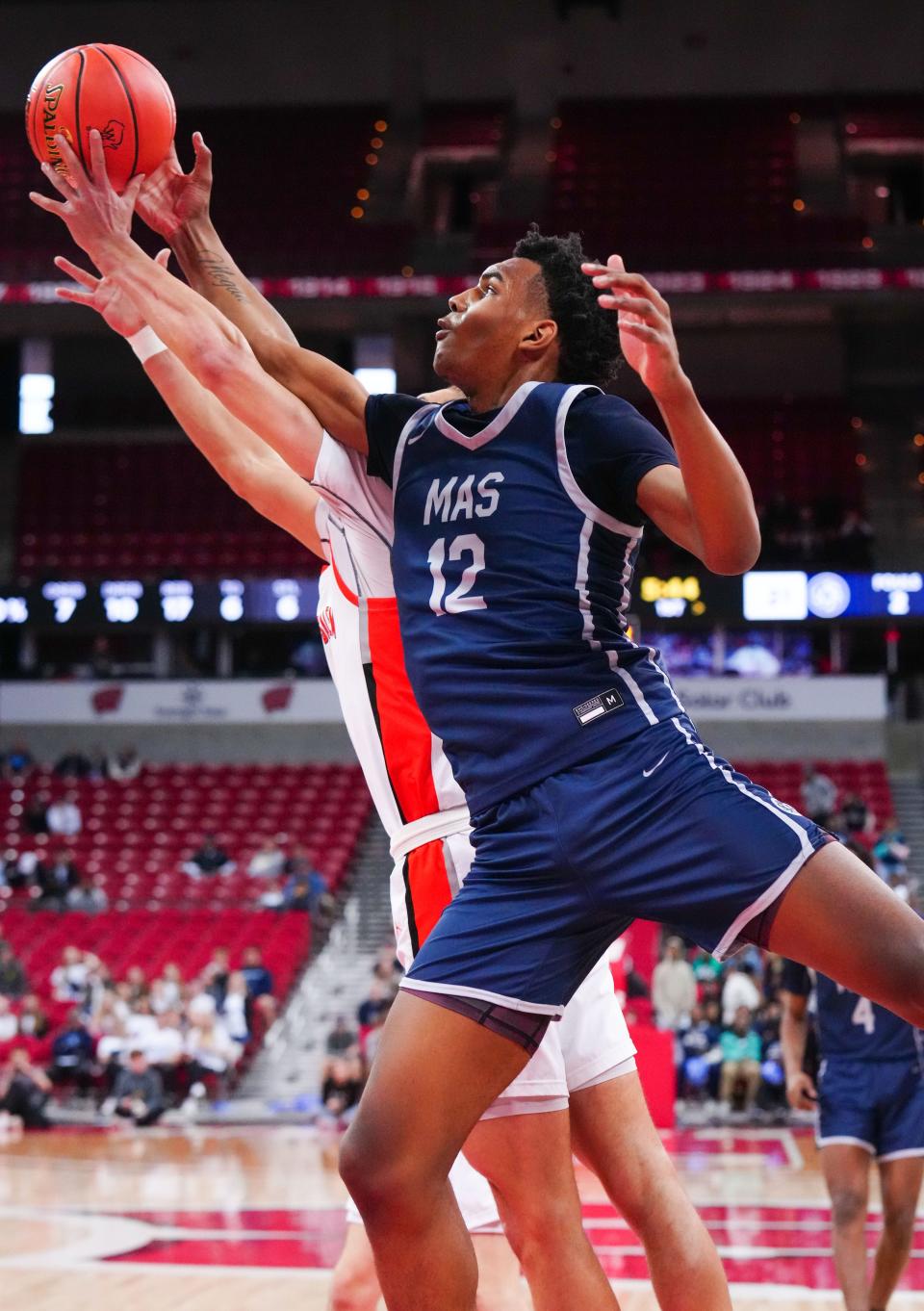 Milwaukee Academy of Science's Devin Brown (12) battles for a rebound against West Salem during the WIAA Division 3 state boys basketball semifinal at the Kohl Center in Madison on Thursday, March 16, 2023.