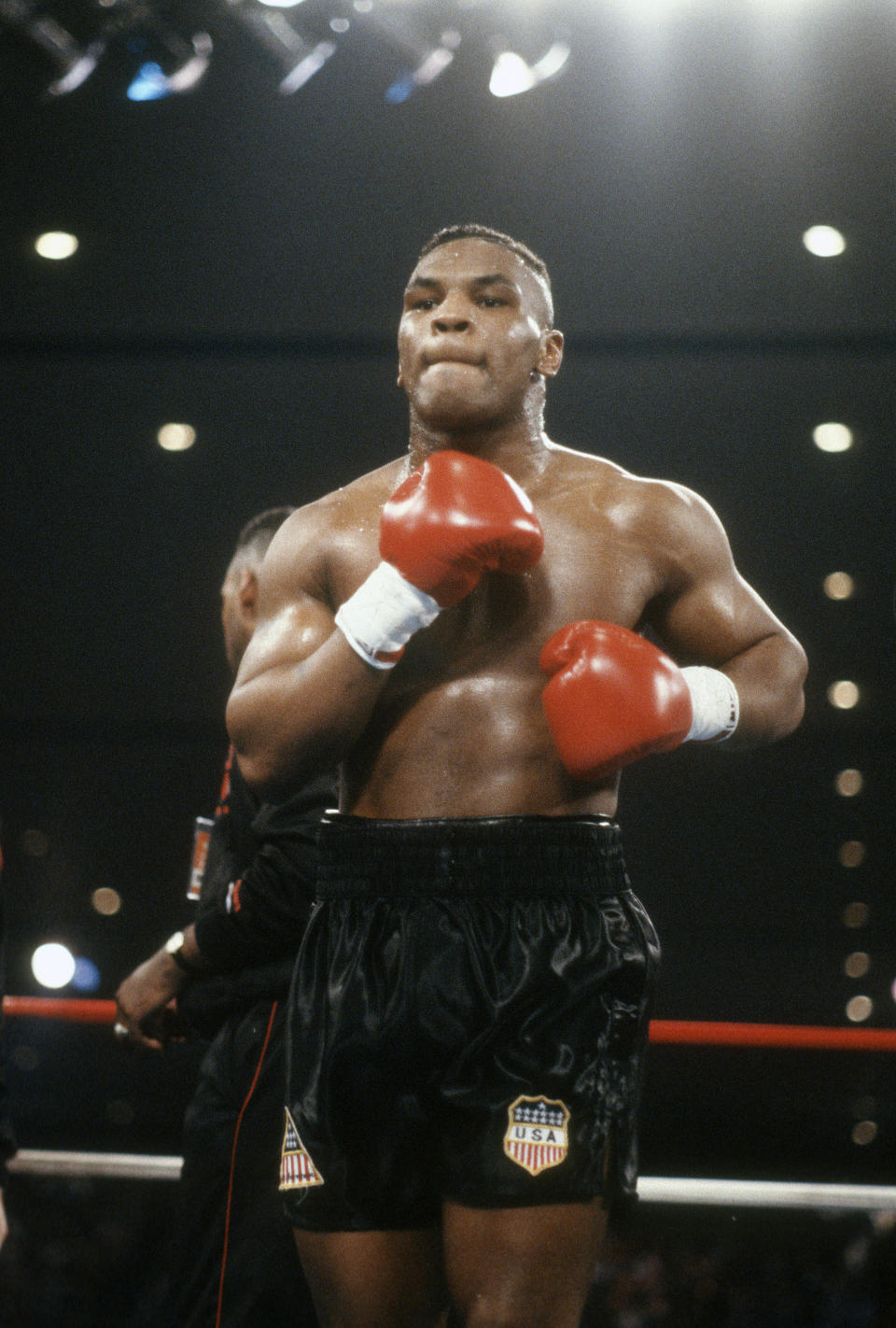 Mike Tyson (pictured) looks on prior to the start of a heavyweight fight against Trevor Berbick.