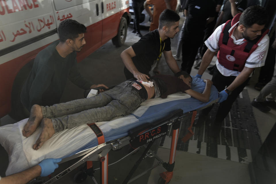 A wounded Palestinian is brought to a hospital during clashes with Israeli forces in Jenin refugee camp in the West Bank, Thursday, Nov. 9, 2023l. (AP Photo/Majdi Mohammed)