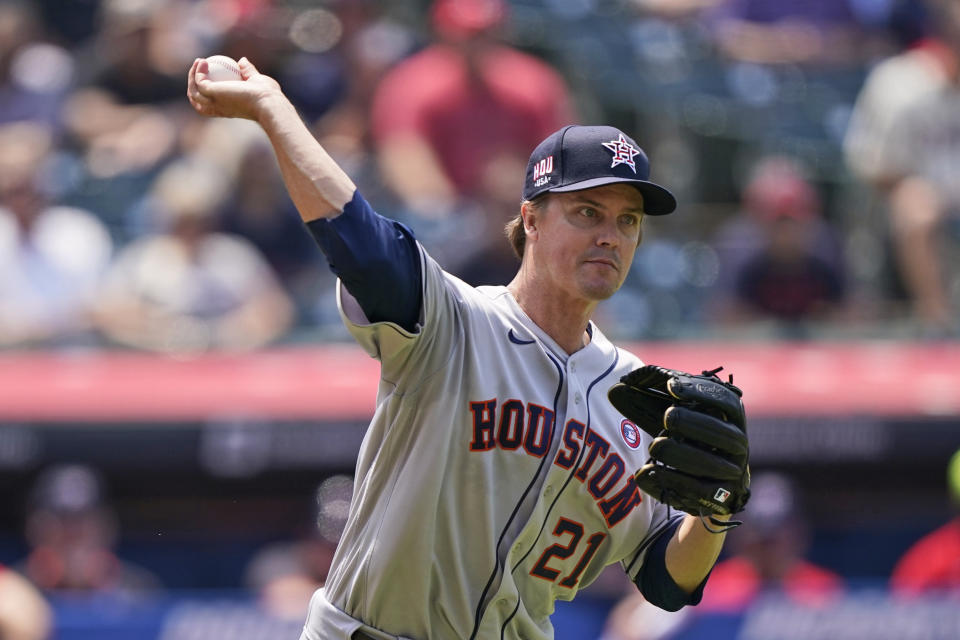 Houston Astros starting pitcher Zack Greinke throws out Cleveland Indians' Roberto Perez at first base after Perez bunted in the fifth inning of a baseball game, Sunday, July 4, 2021, in Cleveland. (AP Photo/Tony Dejak)