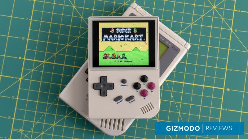 The Anbernic RG35XX playing Super Mario Kart sitting on top of an original Game Boy.