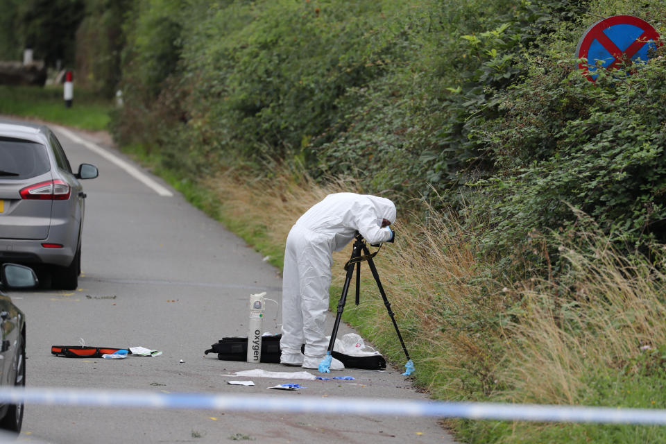 A police investigator at the scene of an incident, near Sulhamstead, Berkshire, where a Thames Valley Police officer was killed whilst attending a reported burglary on Thursday evening.