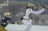 Boston College's Taji Johnson makes a catch against Notre Dame cornerback Benjamin Morrison (20) during the second half of an NCAA college football game, Saturday, Nov. 19, 2022, in South Bend, Ind. Notre Dame won 44-0. (AP Photo/Darron Cummings)