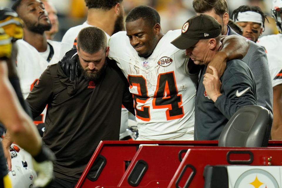 Browns running back Nick Chubb is helped to a cart after an injury during the first half against the Steelers Monday, Sept. 18, 2023, in Pittsburgh.