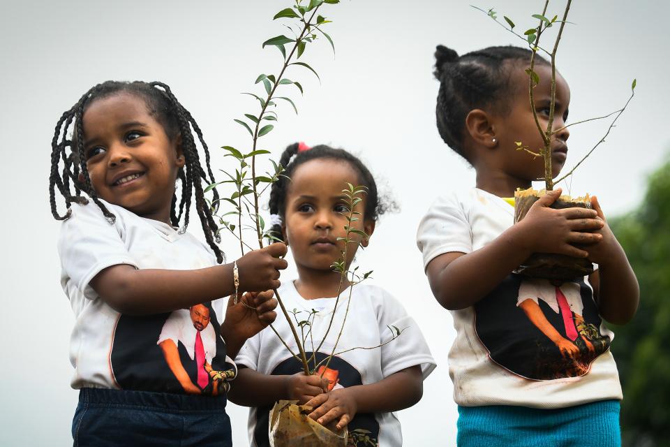 Young Ethiopian girls take part in a national tree-planting drive in the capital, Addis Ababa, earlier this week. (Photo: Michael Tewelde/AFP/Getty Images)