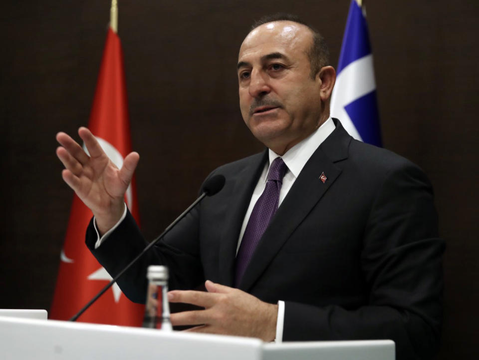 Turkey's Foreign Minister Mevlut Cavusoglu speaks to the media during a joint news conference with his Greek counterpart Giorgos Katrougalos in the Mediterranean coastal city of Antalya, Turkey, Thursday, March 21, 2019. Cavusogly says the defense chiefs of Turkey and Greece could meet soon as part of new confidence-building measures aimed at reducing tensions between the NATO allies. (Turkish Foreign Ministry via AP, Pool)