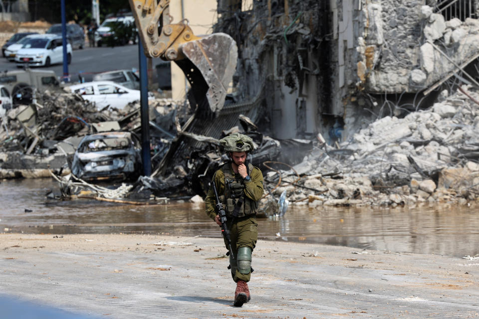 An Israeli soldier patrols near a police station in Sderot, Israel, on Sunday. (Ronen Zvulun/Reuters)