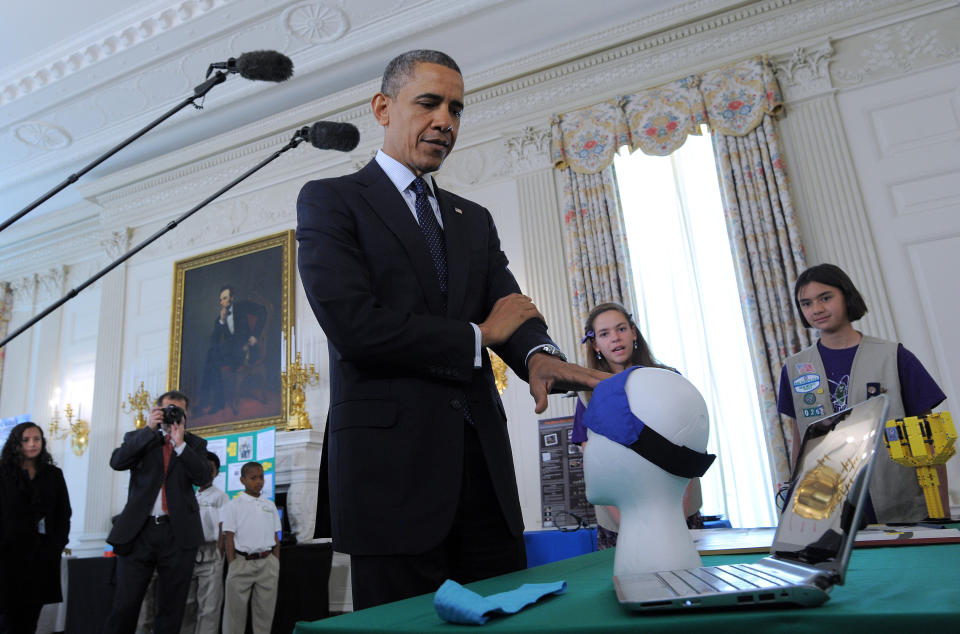 US President Barack Obama visits science fair projects in the State Dining Room of the White House in Washington on April 22, 2013. Obama hosted the White House Science Fair and celebrated the student winners of a broad range of science, technology, engineering and math (STEM) competitions from across the country. 