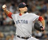 Josh Beckett #19 of the Boston Red Sox pitches against the New York Yankees at Yankee Stadium on August 19, 2012 in the Bronx borough of New York City. (Photo by Jason Szenes/Getty Images)