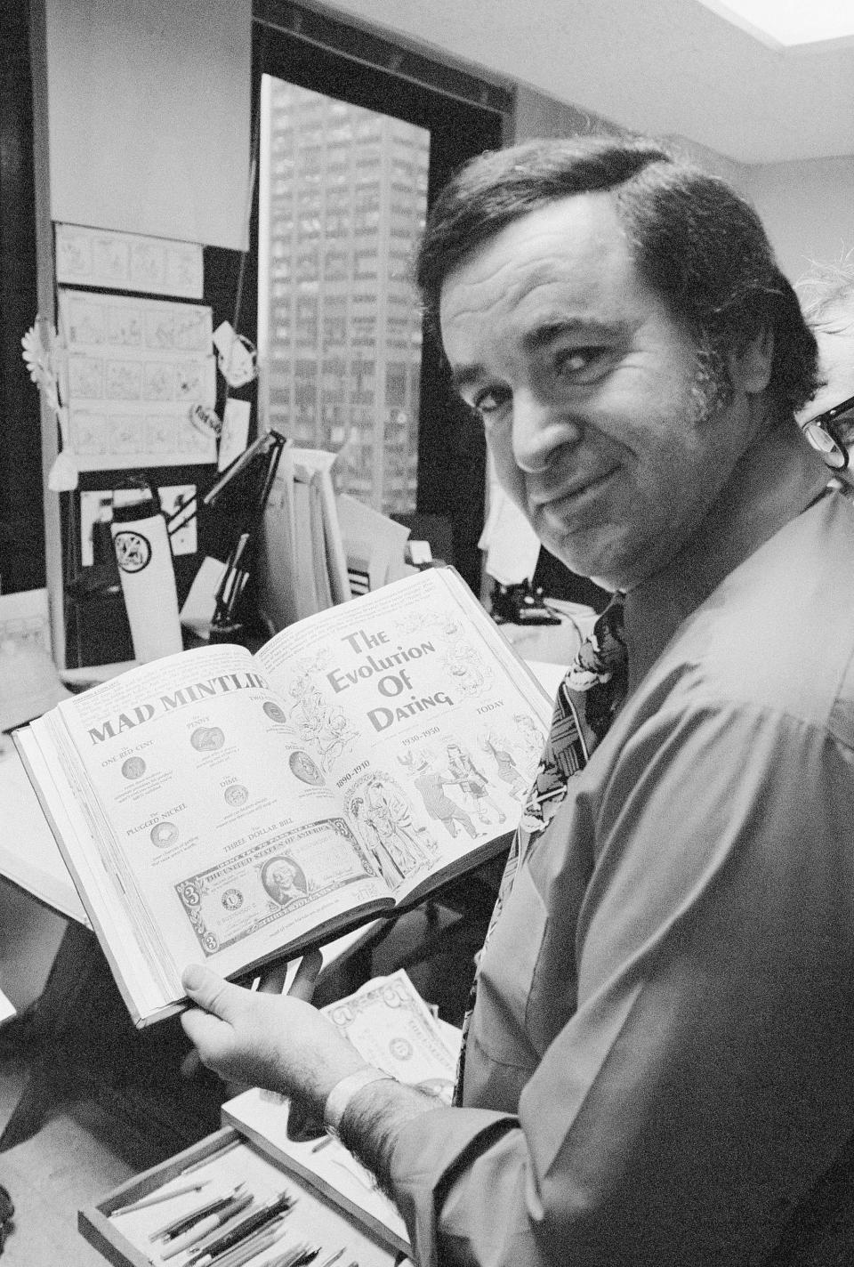 FILE - In this 1972 file photo, "Mad" magazine editor Al Feldstein works on page layout in his office at the magazine's New York headquarters. Feldstein, whose 28 years at the helm of Mad transformed the satirical magazine into a pop culture institution, died Tuesday, April 29, 2014. He was 88. (AP Photo/Jerry Mosey, File)