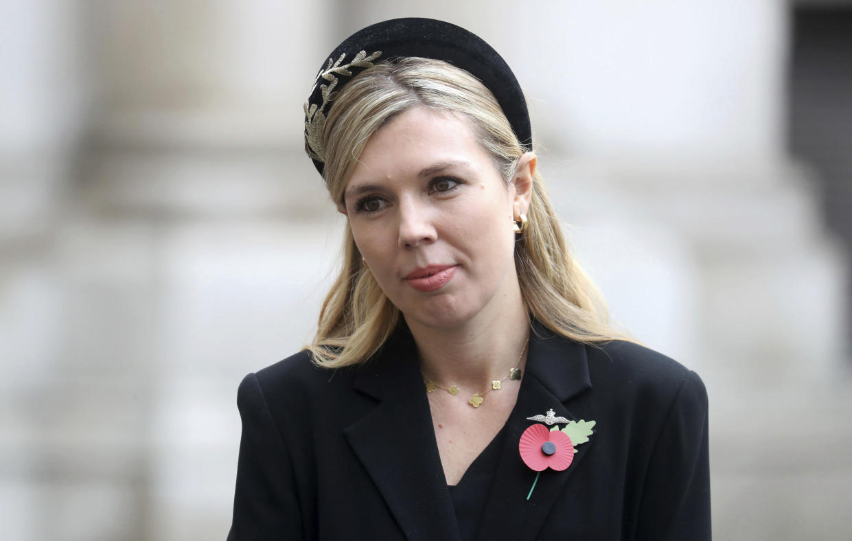 Carrie Symonds, partner of Britain's Prime Minister Boris Johnson, speaks veterans following the Remembrance Sunday service at the Cenotaph, in Whitehall, London, Sunday Nov. 8, 2020. (Chris Jackson/Pool Photo via AP)