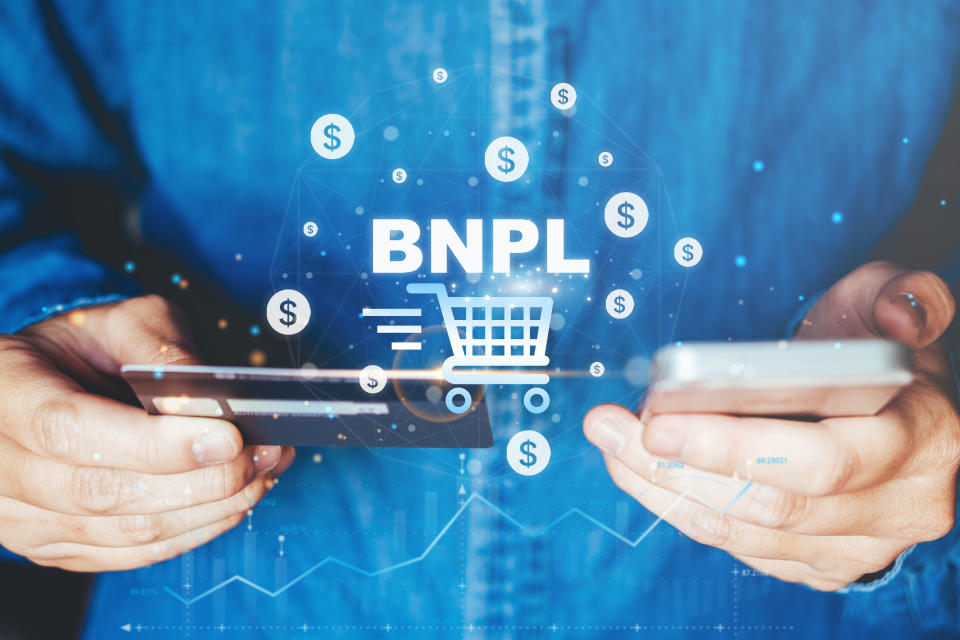 BNPL-Buy Now Pay Later shopping online icon , Online banking businessman using smartphone holding credit card online shopping concept.