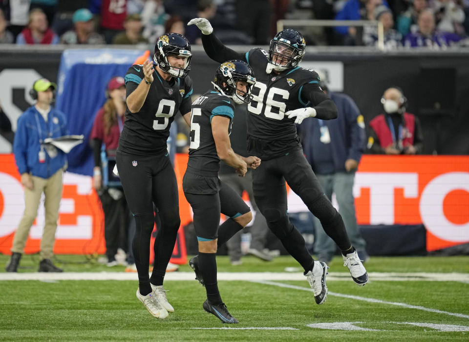 Jacksonville Jaguars kicker Matthew Wright (15), center, celebrates after kicking a field goal to win the match during the second half of an NFL football game between the Miami Dolphins and the Jacksonville Jaguars at the Tottenham Hotspur stadium in London, England, Sunday, Oct. 17, 2021. (AP Photo/Matt Dunhan)