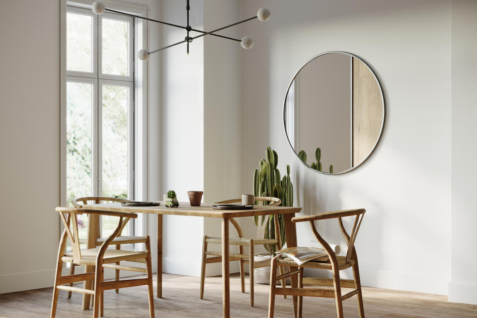 Dining room interior with wooden chairs and table and mirror on the wall. Render image.