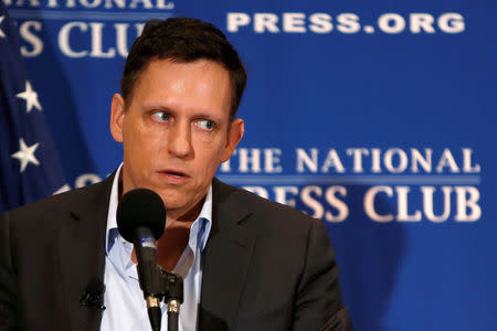 FILE PHOTO - PayPal co-founder and Facebook board member Peter Thiel delivers his speech on the U.S. presidential election at the National Press Club in Washington, U.S., October 31, 2016. REUTERS/Gary Cameron/File Photo