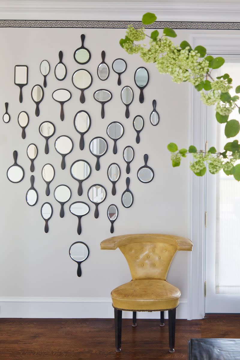 <p>A twist on the typical gallery wall? A gallery wall of antique hand mirrors. Clustered together, these simple, eclectic mirrors function as art (and reflect light beautifully). This one is comprised of hand mirrors and configured in the shape of a hand mirror. These are functional and adorable. No more convincing needed.</p>