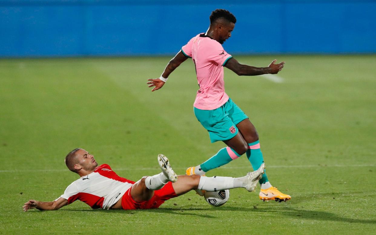 Barcelona's Nelson Semedo in action with Girona's Enric Franques. - REUTERS/Albert Gea.