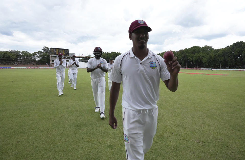 West Indies bowler Gudakesh Motie holds the ball after taking seven wickets on the first day of the second Test cricket match between Zimbabwe and West Indies at Queens Sports Club in Bulawayo, Zimbabwe, Sunday,Feb, 12, 2023. (AP Photo/Tsvangirayi Mukwazhi)