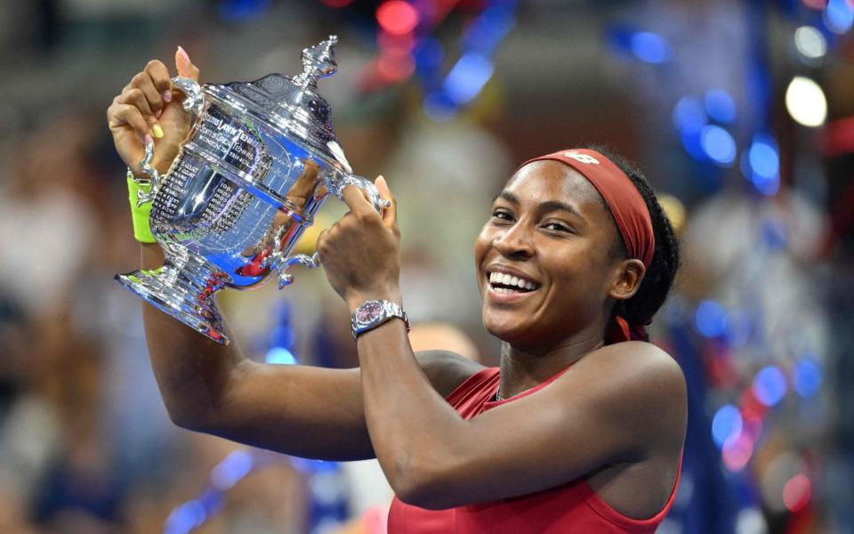 Coco Gauff holding the US Open trophy