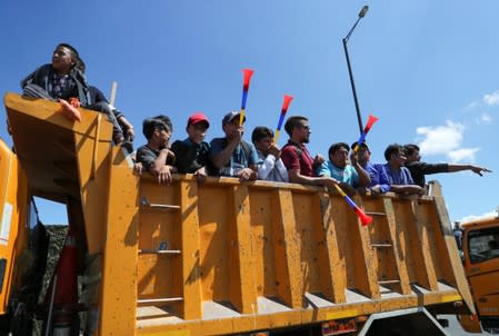 Trucks block main roads during protests after Ecuador's President Lenin Moreno's government ended four-decade-old fuel subsidies, in Carapungo, near Quito