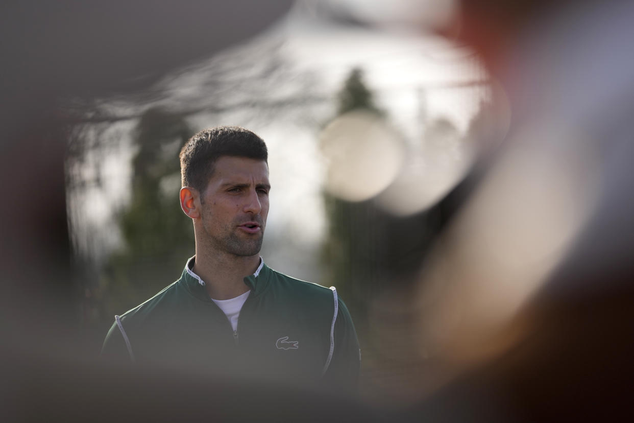 Serbian tennis player Novak Djokovic speaks during a press conference after his open practise session in Belgrade, Serbia, Wednesday, Feb. 22, 2023. Djokovic said Wednesday he still hopes US border authorities would allow him entry to take part in two ATP Masters tennis tournaments despite being unvaccinated against the coronavirus. (AP Photo/Darko Vojinovic)