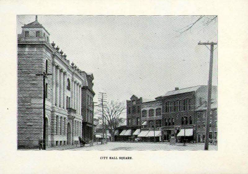 There might have been horses outside at City Hall Square during the 19th century, but the view remains fairly similar to what it is in 2022.