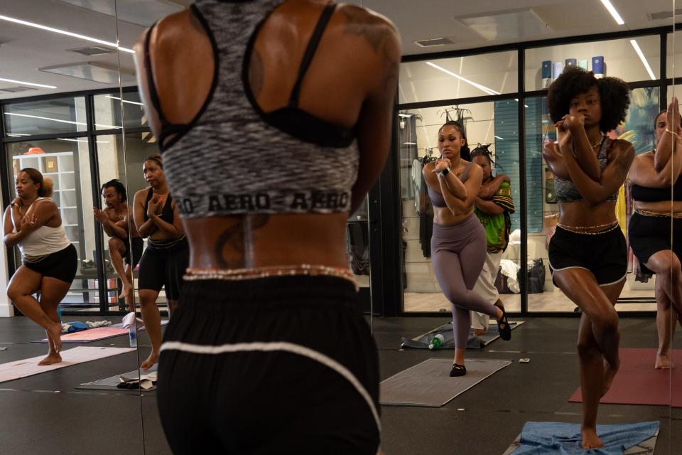 Black and brown men and women gathered in Hot Room's new One Breath class to practice yoga on Saturday, July 3. The class, new this year, is intended to be specifically for people of color as Indianapolis' yoga scene seeks to diversify.