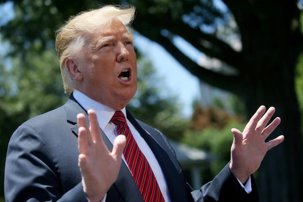 U.S. President Donald Trump speaks to the news media before boarding Marine One to depart for travel to Iowa from the South Lawn of the White House in Washington, U.S., June 11, 2019. REUTERS/Leah Millis