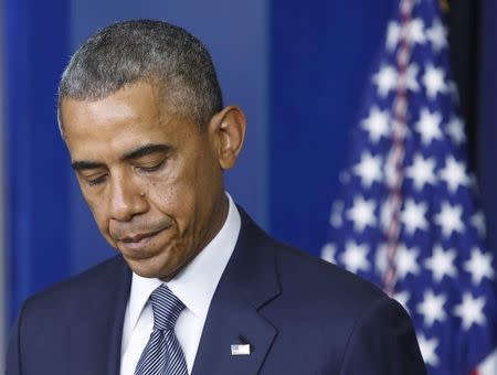 U.S. President Barack Obama pauses while speaking about the situation in Ukraine from the White House in Washington, July 18, 2014. REUTERS/Jonathan Ernst