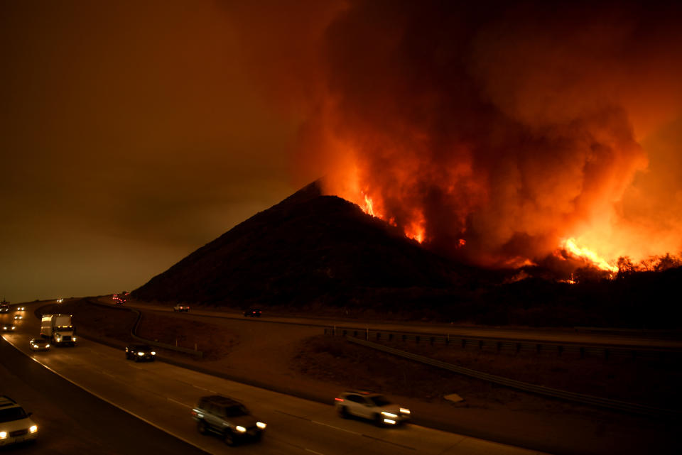 <p>The Thomas Fire burns along the Northbound 101 freeway on Dec. 6, 2017 in Ventura, Calif. (Photo: Wally Skalij/Los Angeles Times via Getty Images) </p>