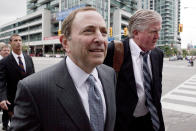 NHL commissioner Gary Bettman, center, and Toronto Maple Leafs general manager Brian Burke, right, arrive for collective bargaining talks in Toronto on Tuesday, Aug. 14, 2012. Negotiations continue between the league and the NHLPA to avoid a potential lockout. (AP Photo/The Canadian Press, Chris Young)