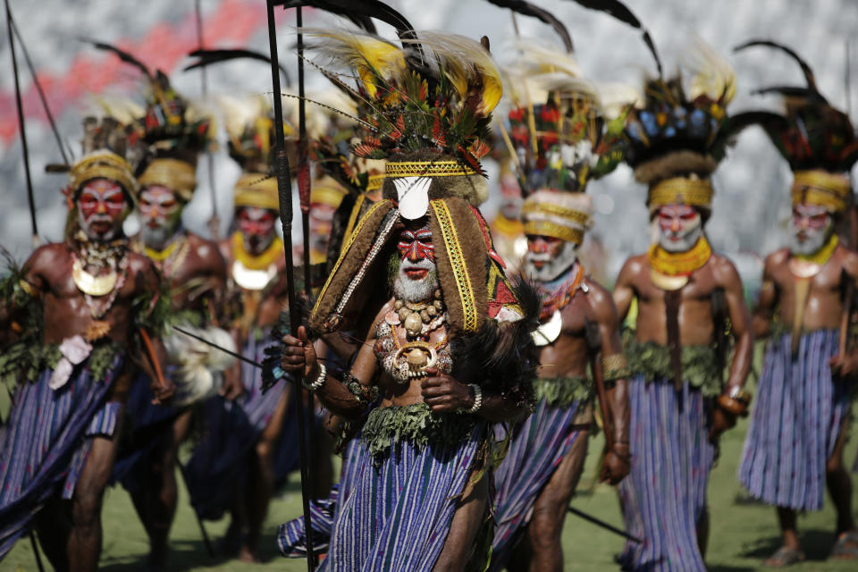 Dancers wearing traditional costumes perform during a cultural show as part of APEC 2018 activities at Port Moresby, Papua New Guinea on Friday, Nov. 16, 2018. (AP Photo/Aaron Favila)