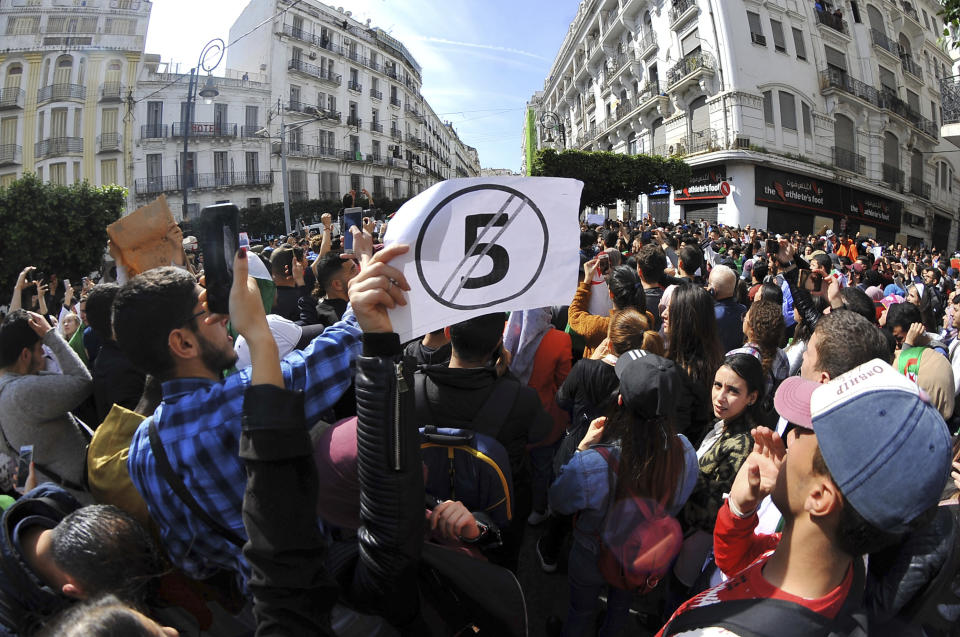 Hundreds of students gather in central Algiers to protest Algerian President Abdelaziz Bouteflika's decision to seek fifth term, Tuesday, March 6, 2019. Algerian students are gathering for new protests and are calling for a general strike if he doesn't meet their demands this week. (AP Photo/Fateh Guidoum)