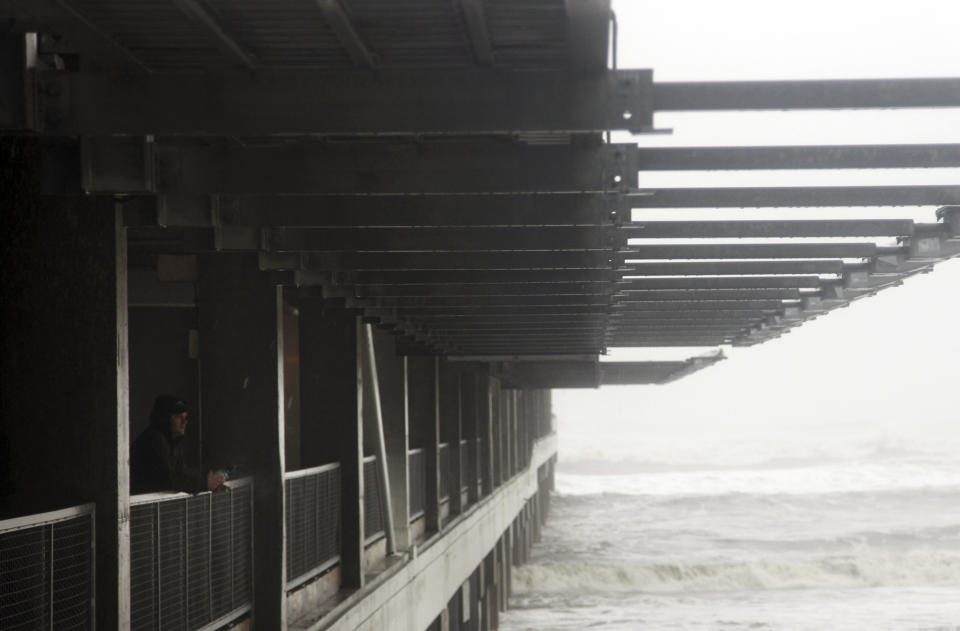 Ray Bartling, a facilities manager for the Pier Shops at Ceaser's, looks over the rough surf in Atlantic City, N.J., Monday, Oct. 29, 2012. (AP Photo/Seth Wenig)