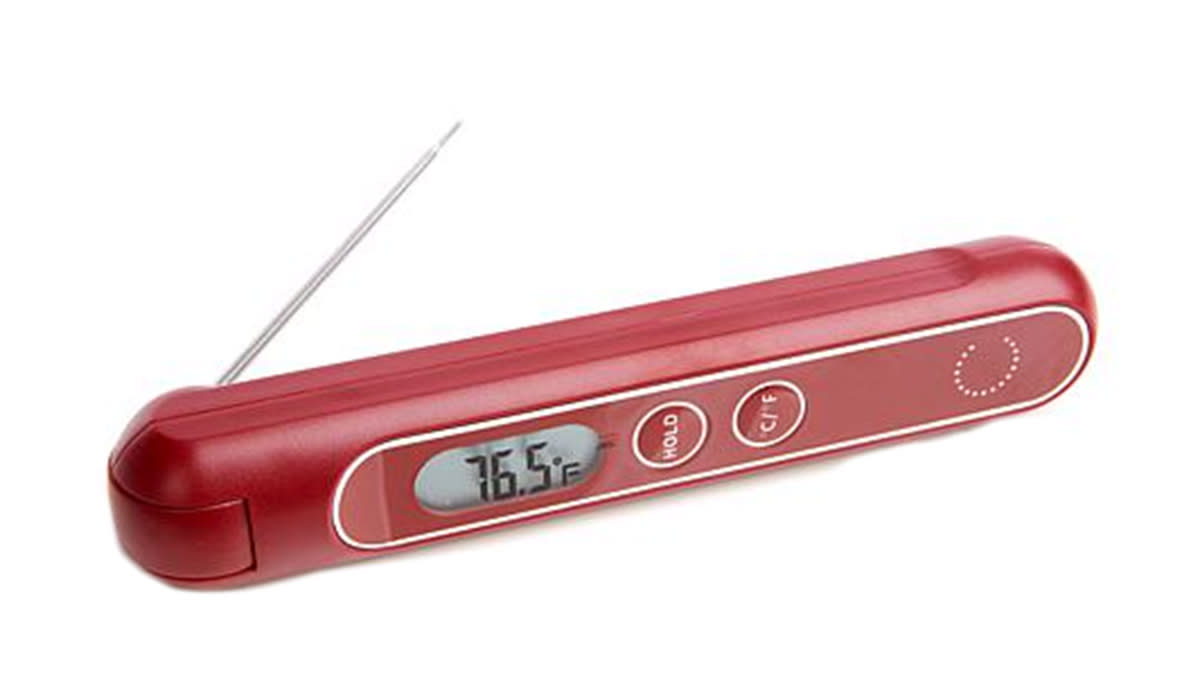 Red meat thermometer with digital screen reading 76.5 degrees farenheight