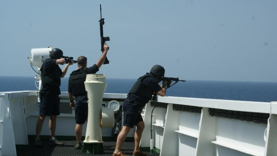 British maritime security guards "showing weapons" to ward off pirates from the bridge of a merchant tanker on an earlier voyage. It is understood there were armed guards on board the MT Mercer Street when it was attacked