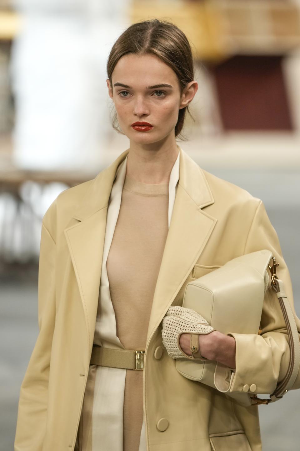 A model wears a creation as part of the Tod's women's Spring Summer 2024 collection presented in Milan, Italy, Friday, Sept. 22, 2023. (AP Photo/Luca Bruno)