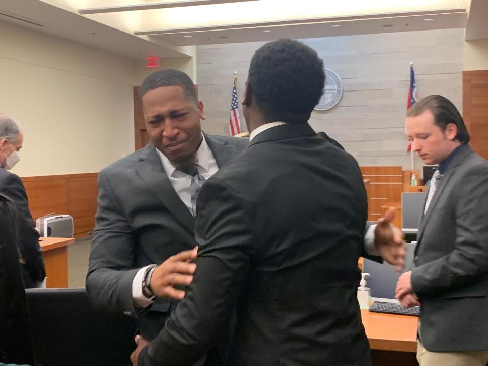 Amir I. Riep (facing camera) and Jahsen L. Wint (foreground), both 24, embrace on Feb. 9, 2023 after a Franklin County jury found them not guilty of a 2020 rape.  Riep and Wint were defensive players for the Ohio State University football team when a woman in her freshman year at Ohio State accused them of raping her on Feb. 4, 2020.