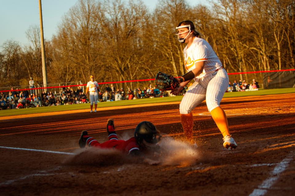 Austin Peay Govs Morgan Zuege (9) slides in to home during the Midstate Classic at Ridley Sports Complex in Columbia, Tenn. on Mar. 15, 2023.