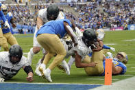 Oregon running back Travis Dye is stopped just short of the goal line during the first half of an NCAA college football game against UCLA, Saturday, Oct. 23, 2021, in Pasadena, Calif. (AP Photo/Marcio Jose Sanchez)