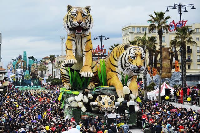 <p>Laura Lezza/Getty Images</p> A giant papier-mâché float moves through the streets of Viareggio during Carnival.