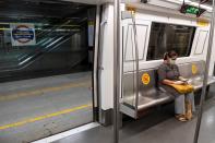 A commuter sits in a carriage of a Yellow Line train after Delhi Metro Rail Corporation (DMRC) resumed services in New Delhi on September 7, 2020.(Photo by PRAKASH SINGH/AFP via Getty Images)