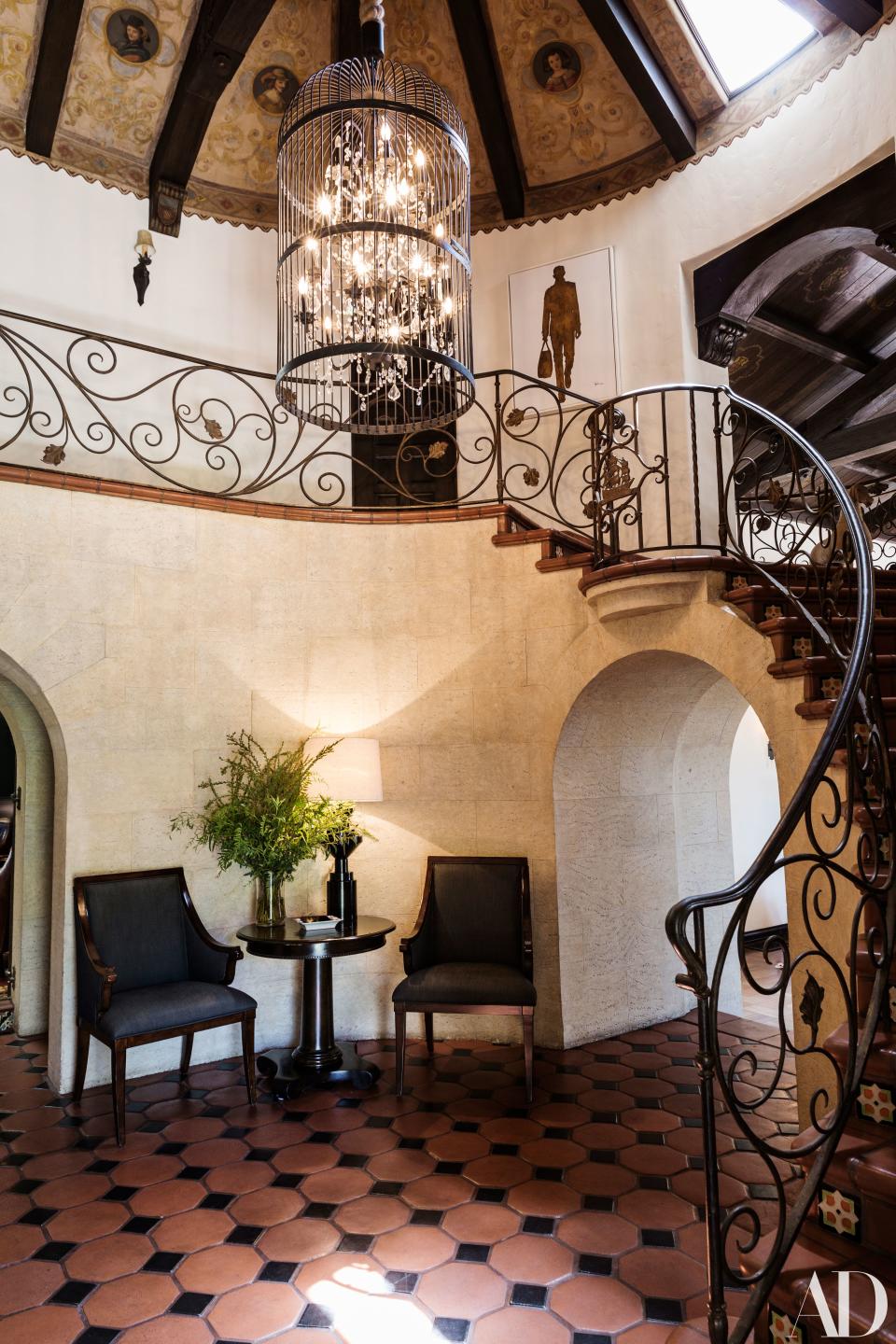 “We didn’t want it to be intimidating when you walk in because it’s all plaster and Gothic-painted ceilings, so I think putting the Restoration Hardware birdcage over the custom chandelier was part of that, to make it more fun,” says Gurski.