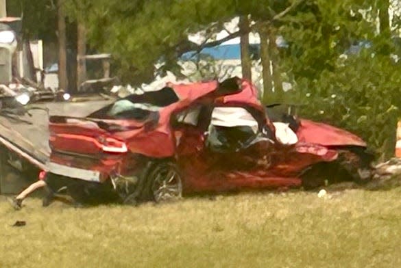 A father of three from Port Orange was killed when a Range Rover smashed into the side of his Dodge Charger after running a red light Saturday morning. Police say he was looking at his cellphone.