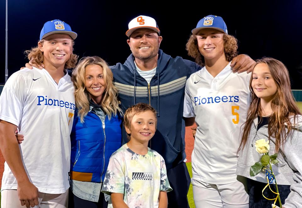 Oklahoma State baseball volunteer coach Matt Holliday is pictured with his family at a Stillwater High School game. Pictured from left is Jackson, Matt's wife Leslee, Reed, Ethan and Gracyn.