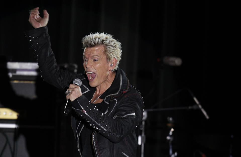 Billy Idol performs Friday, Oct. 26, 2012, in Seattle. Idol came to play in Seattle after Michael Henrichsen launched a two-year grass-roots campaign to convince the rock start to play for his birthday party. (AP Photo/Ted S. Warren)