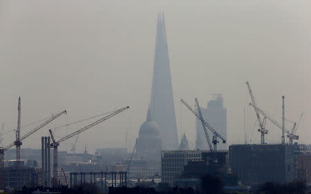 Smog surrounds The Shard and St Paul's Cathedral in London, Britain, April 3, 2014. REUTERS/Suzanne Plunkett/File Photo