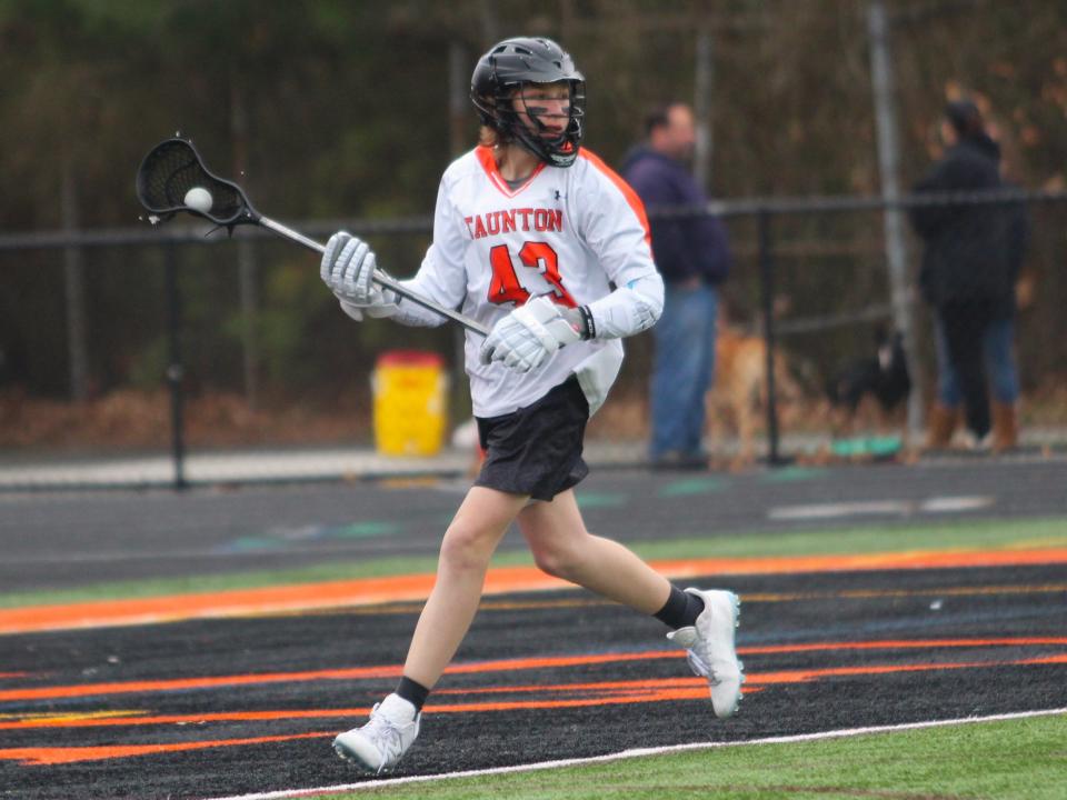 Taunton's Shane Lynds cradles the ball during a non-league game against Dighton-Rehoboth.